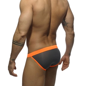 Rear view of mens grey low rise swim briefs with vibrant orange trim and athletic fit