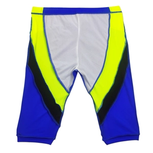 Detailed top view of professional quick-dry swim shorts with blue and yellow contrast panels
