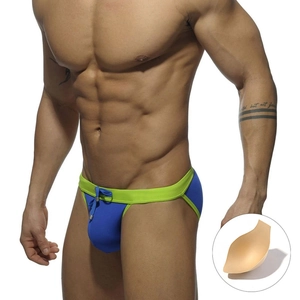 Men's blue high-cut swimming briefs with neon green trim and removable sponge pad inserts