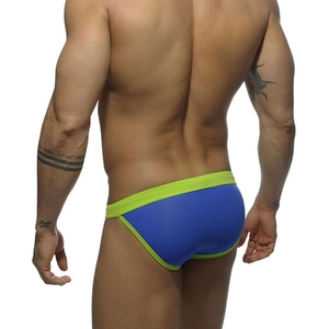 Rear view of sexy men's blue swim briefs with neon green trim and high-cut elastic fit