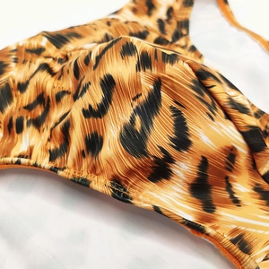 Detail of tiger print men's swim briefs showing ribbed texture and high-quality stitching
