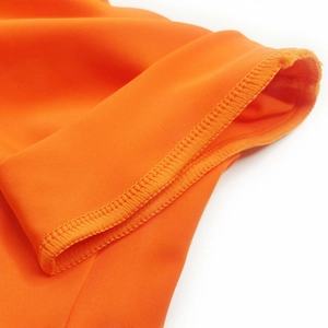 Detailed view of the orange elastic fabric with professional double-needle stitching seams