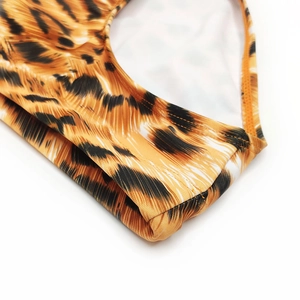 Close-up of double-needle stitching on tiger print men's quick-dry swimwear fabric