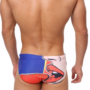 Rear view of men's sexy swim briefs with pop art strawberry print in blue and pink