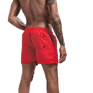 Rear view of men's red quick-dry beach shorts featuring elastic waistband and pocket