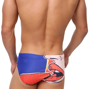 Detail of blue men's swim briefs featuring a pop art lips and tongue print on the back