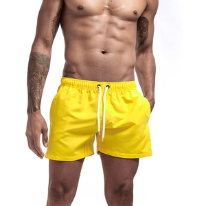 Men's quick-dry yellow beach shorts with elastic waist and white drawstring detail