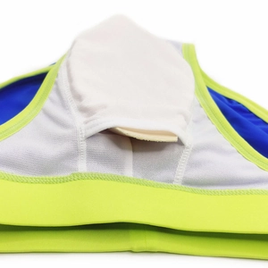 Detail of blue men's swim briefs featuring white mesh lining and removable cup padding