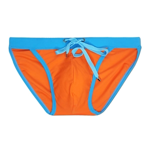 Detail of orange men's bikini swimsuit with light blue contrast trim and drawstring cords