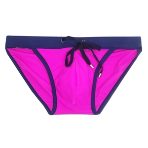 Detail of pink men's swim briefs with blue contrast waistband and metal-tipped drawstring