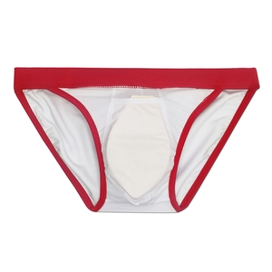 Detailed view of white men's swim briefs with red piping and built-in protective inner pad