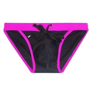 Detail of men's swim briefs in black and neon pink with metal-tipped drawstrings