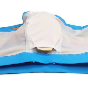 Detailed macro view of men's swim trunks featuring breathable mesh lining and insert pouch