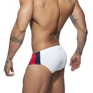 Detailed back view of men's low-waist tricolor swim briefs in white, red and navy