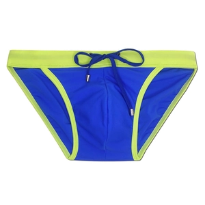 Detail of royal blue men's swim briefs with lime green trim and adjustable drawstring