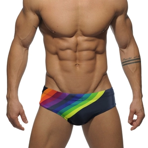 Men's low waist swim trunks in black featuring vibrant rainbow stripes and athletic fit