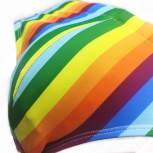 Detail of colorful striped fabric showing high-quality flatlock stitching on swimwear