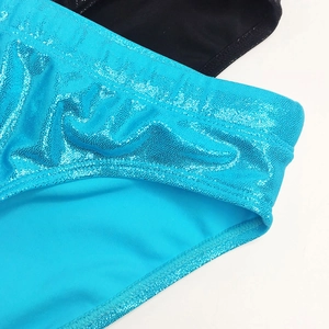 Detail of blue sequined metallic fabric and stitching on shiny faux leather swimwear