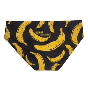 Détail du slip de bain noir avec imprimé bananes et logo de la marque au dos