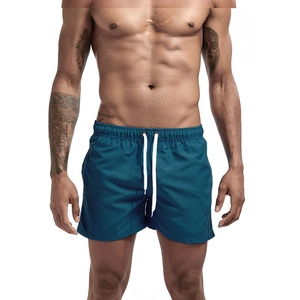 Men's quick-dry athletic shorts in deep teal with elastic waist and white drawstring