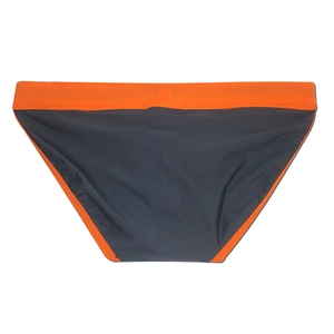 Detailed flat lay of men's low-waist briefs with orange waistband and dark grey panels