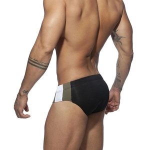 Rear view of mens color-block swim briefs showing athletic fit and high-stretch fabric