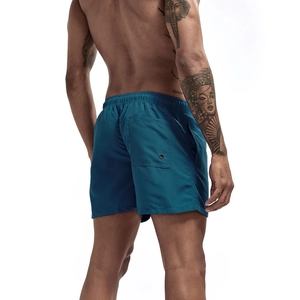 Detail view of quick-dry men's swim shorts featuring an elastic waistband and back pocket
