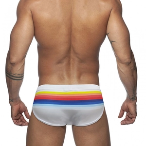Detail view of white men's swim briefs with vibrant rainbow stripes on the back side