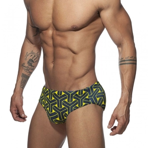 Detailed close-up of men's swim briefs featuring a bold blue and yellow geometric pattern