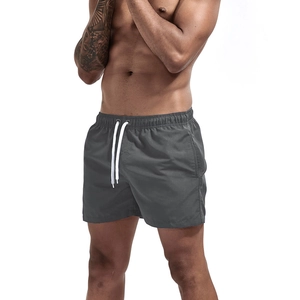 Close-up of men's quick-dry sports shorts with elastic waistband and white drawstring cord