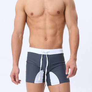 Close-up of men's quick-dry swim trunks with gray and white contrast panels and drawstring
