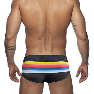 Rear view of mens black swim briefs with vibrant rainbow stripes on stretch fabric