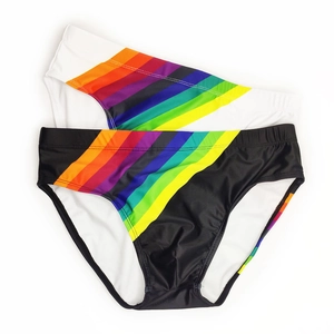 Close-up of men's colorful striped swim briefs in black and white quick-dry fabric
