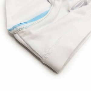 Close-up of white swimwear stitching with premium elastic fabric and blue striped lining