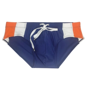 Detail of navy swim briefs with orange side panels and adjustable white drawstring cord