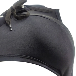 Macro detail of black translucent mesh fabric and woven strap on men's swimwear