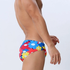 Men's sexy floral print swim briefs with vibrant red blue and yellow blossoms