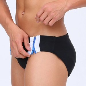 Detail view of quick-release side double zippers and color-block design on men's swim briefs