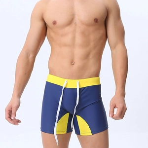 Navy blue and yellow swimming trunks with drawstring waist and contrast stitching detail