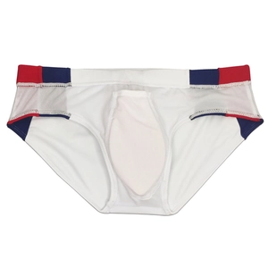 Detail view of white men's swim briefs with red and blue color-block design and pouch