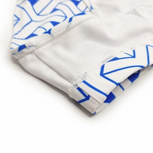 Close-up of geometric pattern print and durable double-needle stitching on men's swimwear