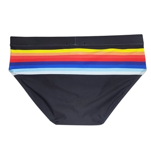 Close-up of black men's swim briefs featuring colorful rainbow stripes on waistband