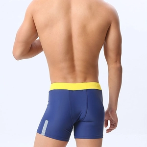 Rear view of men's blue swimming shorts with yellow waistband and reflective side stripes