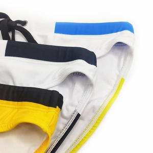 Detail of men's low-waisted swim briefs with adjustable drawstrings and contrast stitching