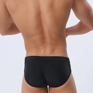 Rear view of black hollow mesh men's swim briefs showing elastic waist and stretch fabric