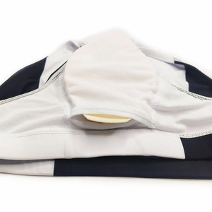 Detail view of men's swim trunks featuring a padded cup pouch and mesh fabric texture