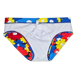 Detail view of men's floral swim briefs showing white drawstring and breathable lining