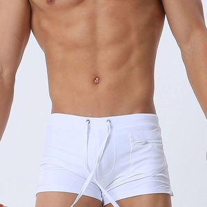 Detail view of men's white swim trunks showing the drawstring waist and side zipper pocket