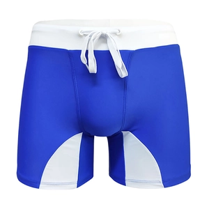 Detail of royal blue swim trunks showing white elastic waistband and adjustable drawstring