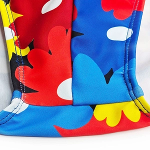 Macro detail of high-elastic swimwear fabric with colorful floral prints and flatlock seams